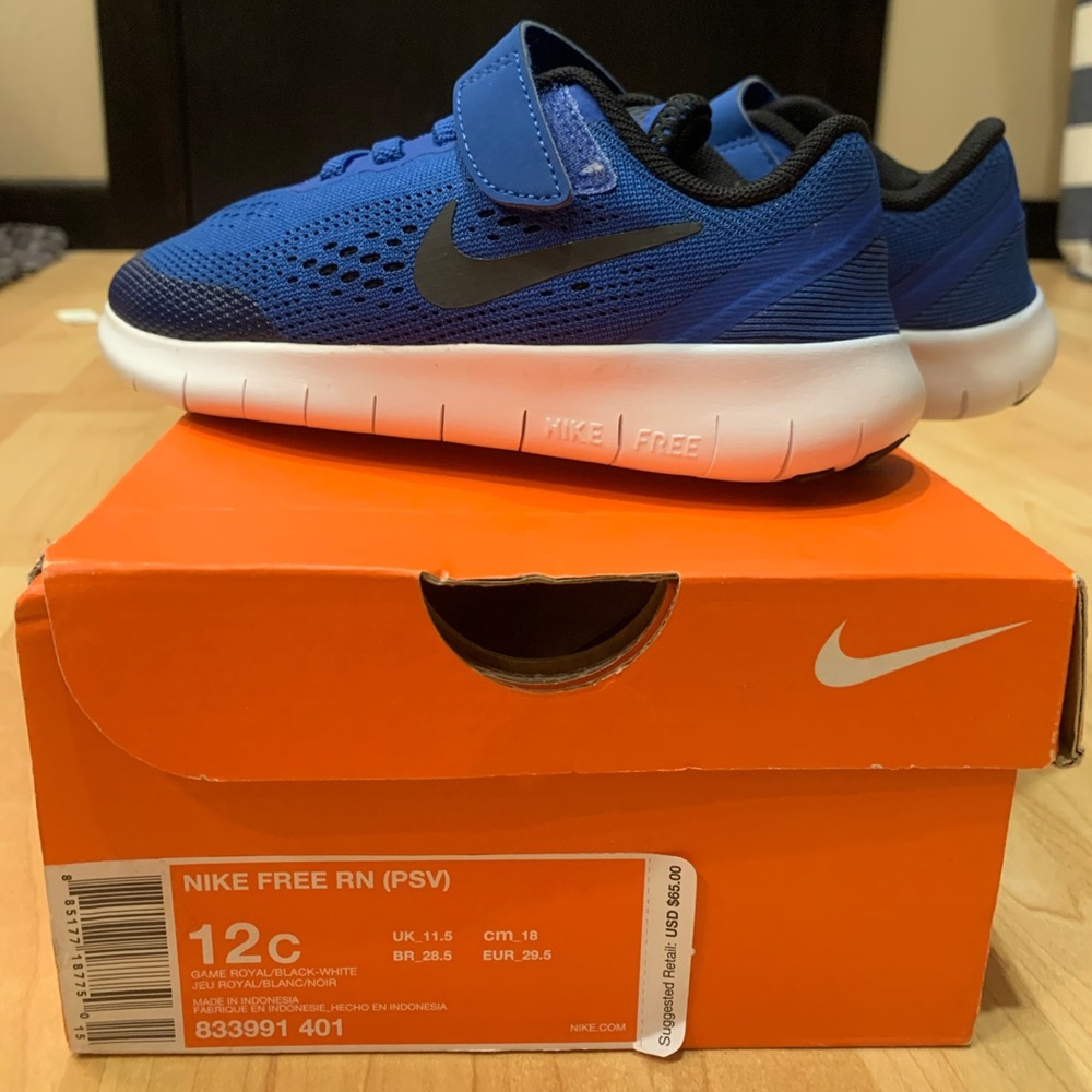 Blue and black nike children’s sneakers size 12